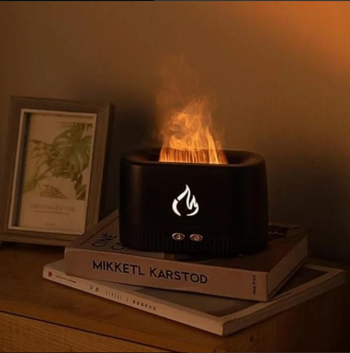 Tradeo fireplace flame aroma diffuser on a bedside table