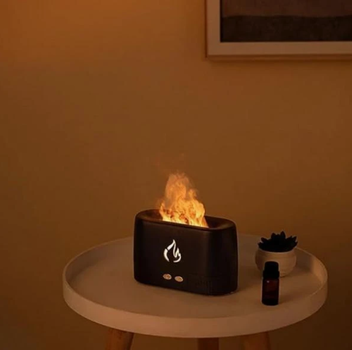 Black flame aroma diffuser and humidifier in a living room