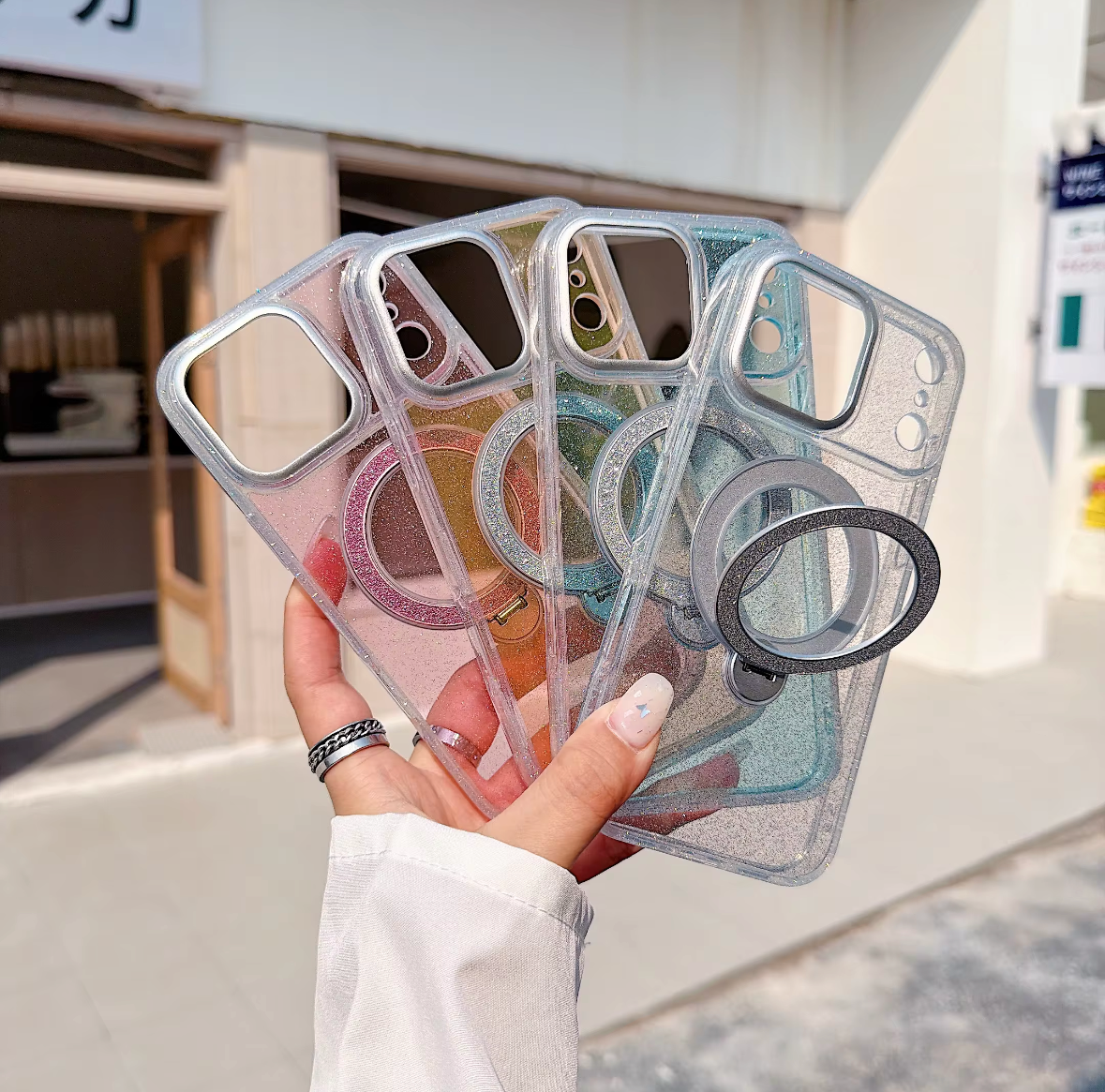 Clear glitter phone cases showing wide camera cutout and ring stand