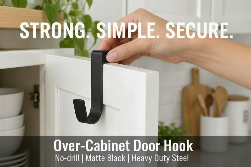 Hand installing a black over-door cabinet hook