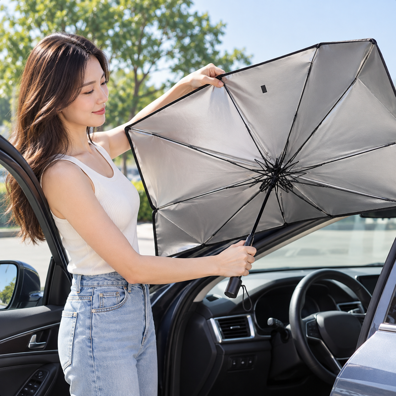 Driver opening the foldable windshield sunshade umbrella